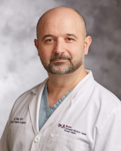 Dr. Ali                                                     Baaj