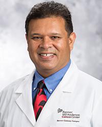 Dr. Mohamed                   Khan
